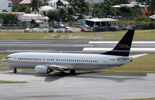 BOEING 737-400 (FLE1672) - Fliair air C-FLEJ taxing to bravo for take off at TNMC on 05-01-2013