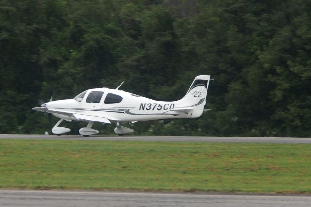 Cirrus SR-22 (N375CD) - Landing on rwy 26 unannounced when the active was 8 and there was traffic on short final to 8.  Fortunately someone saw the conflict and alerted the 8 traffic to go around.  