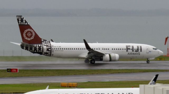 Boeing 737-800 (DQ-FJM) - Fijian 737-800 drying out a soggy runway.