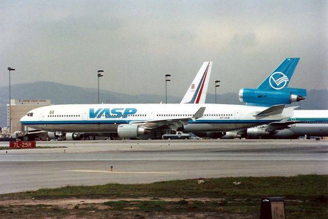 Boeing MD-11 (PP-SOW) - KLAX - Feb 1992 - Just arrived for the Inaugural flight to Sao Paulo- This brand new MD-11 taxis to the gate. I did not know when I took this that the MD-11 was brand new and arriving for the 1st Revenue flight LAX-SAO. Photo from the old Imperial Terminal Parking lot..