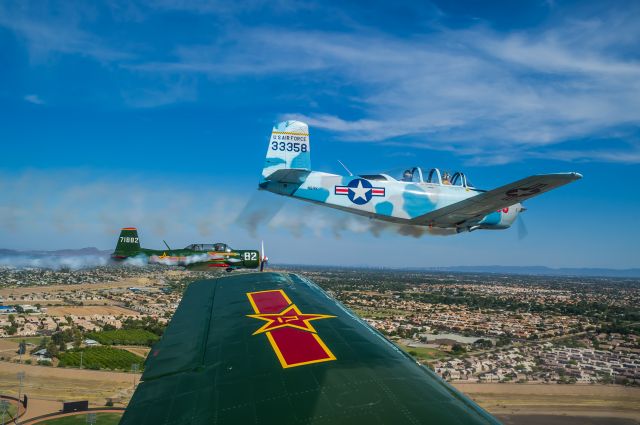 Piper Apache (N6HK) - Smoke On!<br>Formed up for a 6-ship flyover of a Spring Training game at Peoria Stadium. Also in the shot is CJ6 Nanchang N4182C. Shooting from CJ6 N23YK. <br>©Bo Ryan Photography | a rel=nofollow href=http://www.facebook.com/BoRyanPhotowww.facebook.com/BoRyanPhoto/a Please vote if you like the image!