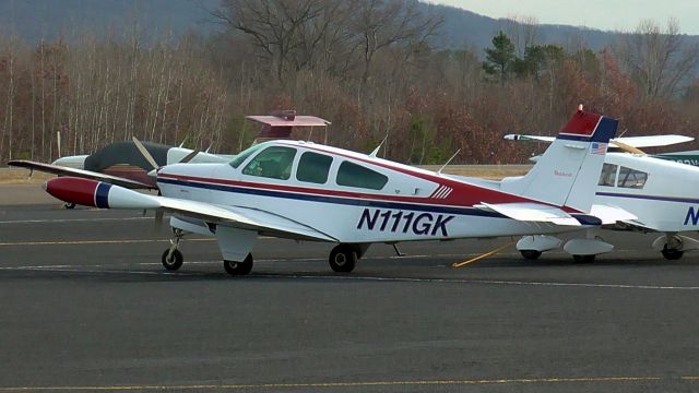 Beechcraft Bonanza (33) (N111GK) - Parked in the transient before its flight to Islip (KISP).