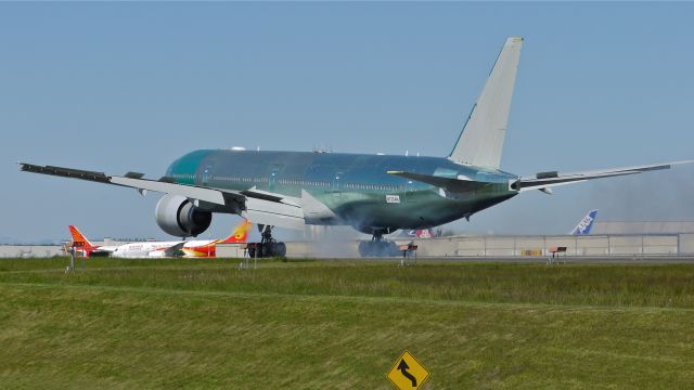 BOEING 777-300 (N723AN) - BOE307 touching down on runway 34L to complete a flight test on 5/1/13. (LN:1103 cn 33125).