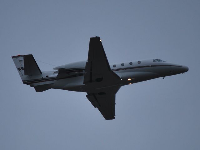 Cessna Citation Excel/XLS (N603QS) - Departing in drizzle from runway 20 at Concord Regional Airport - 2/18/09