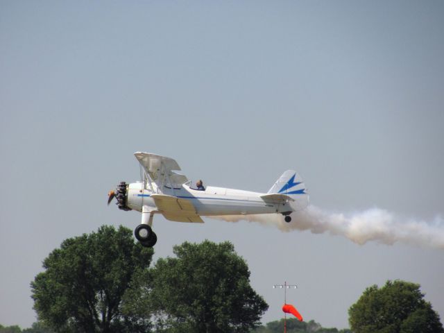 — — - White biplane taking off during a fly in at Great Bend, KS