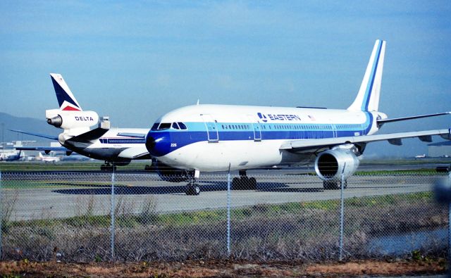 N225EA — - KSFO - Millbrae Ave airpark late 1980s...a great place to jet watch before it was closed. N225EA shown here on the delay pad as a Delta DC-10 departs 1R.