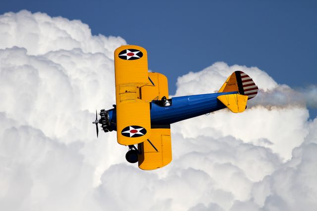 N49739 — - Stearman in front of the puffy clouds