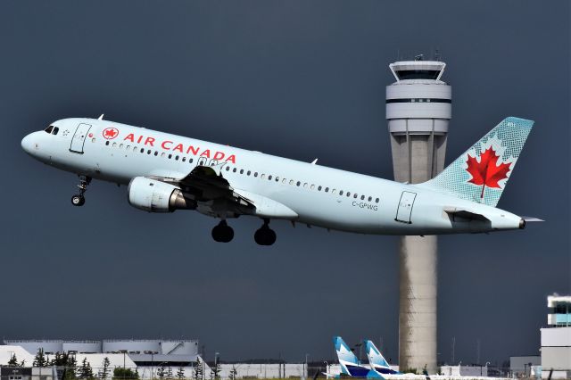 Airbus A320 (C-GPWG) - Air Canada Airbus A320-211 departing YYC with a storm in the background on July 14.