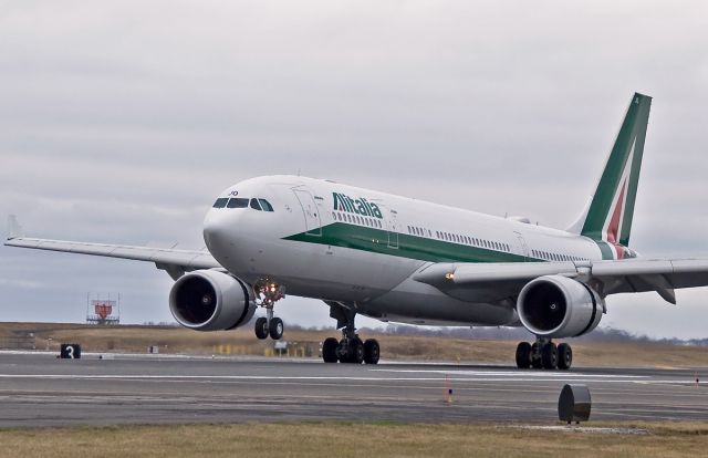 Airbus A330-300 (EI-EJO) - touching down on 04R 