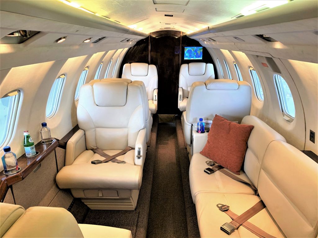 N524LR — - Interior photo of cabin showcasing couch in the back and captain chair at the hangar.