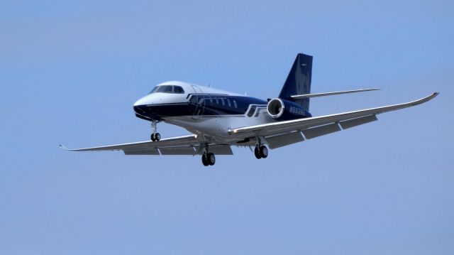 Cessna Citation Latitude (N603NE) - On final is this 2017 Cessna Citation Latitude in the Spring of 2019. Appears to have an image of a clock tower on the tail?