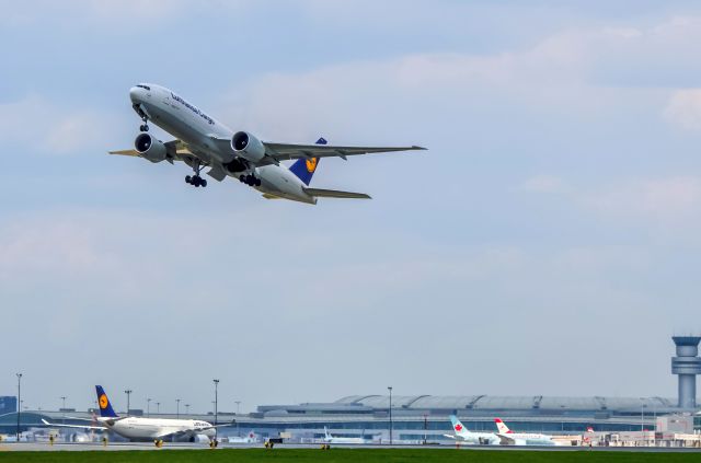 Boeing 777-200 (D-ALFD) - Rare have two Lufthansa together at Toronto, one just landed and one depart by same runway.  Lufthansa A333 from Munich just landed exit runway to let D-ALFD take off.