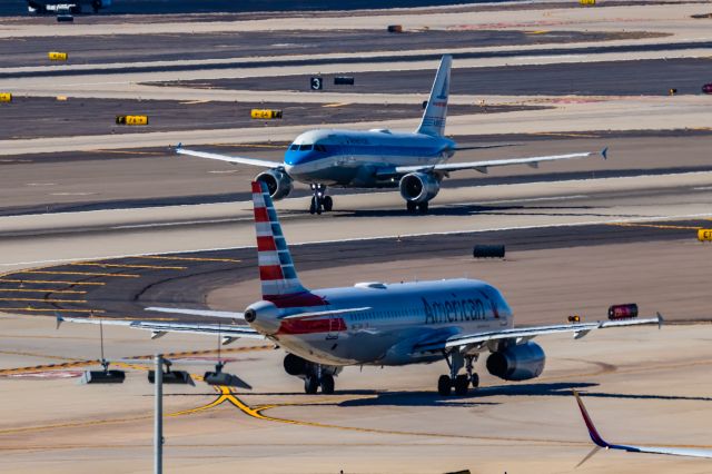 Airbus A319 (N744P) - An American Airlines A319 in Piedmont retro livery taking off from PHX on 2/24/23. Taken with a Canon R7 and Canon EF 100-400 ii lens.