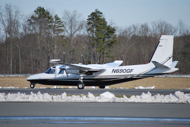 Aero Commander 500 (N690GF) - Taxiing to runway 20 at Concord Regional Airport - 3/4/09