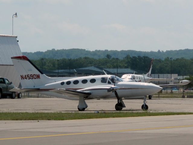 Cessna 421 (N459DM) - The top line of Cessna's piston twins. Pressurized. Geared engines. This is a late model with integral tanks and trailing link gear. Very nice.