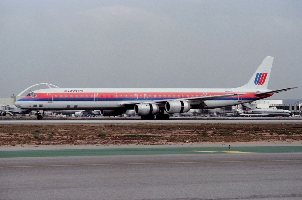 McDonnell Douglas DC-8-70 (N8080U) - KLAX - March 1989 or 1990 shows DC-8-71 landing 25L and rolling out to the high speed exit - photo from the Imperial Terminal Lot.
