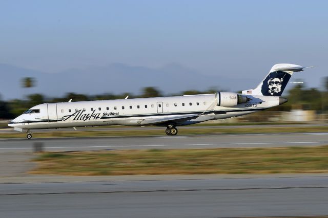 Canadair Regional Jet CRJ-700 (N216AG) - Rolling down runway 30 at Long Beach Airport.