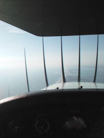 Cessna Skyhawk (N9616L) - In flight just south of Gabreski airport over the beach.