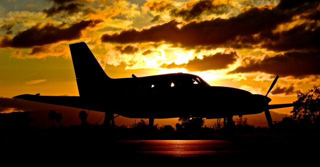 Cessna 421 (N6867L) - Local Cessna 421 sitting at its tie down during sunset at Reid Hillview.