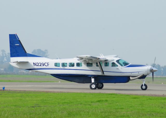 Cessna Caravan (N229CF) - Cessna Caravan (N229CF)exits runway three-zero, taxiway "Echo" at Merced Regional Airport (KMCE)