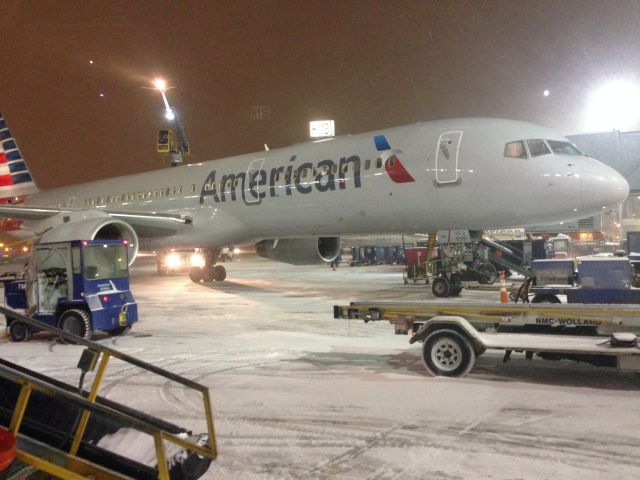 Boeing 757-200 — - De-icing  during a snowstorm at ORD