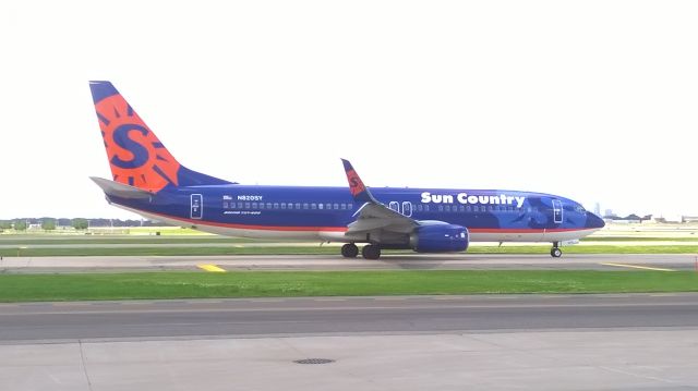 Boeing 737-800 (N820SY) - Sun Countrys newest addition to their fleet,a Boeing 737-800 with split scimitars!!this photo was taken from the airport fire station as the bird was taxiing to the runway.