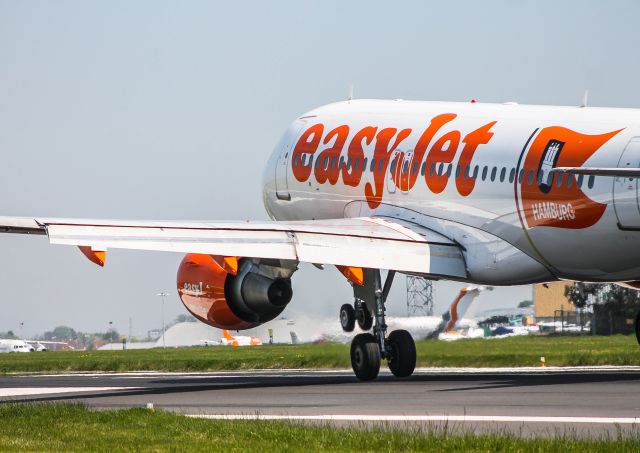 Airbus A319 (G-EZBG) - Hamburg Livery painted on this A319 touching down on then 06