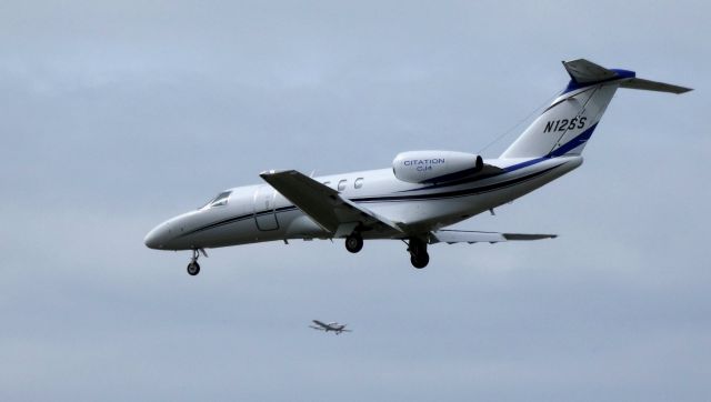 Cessna Citation CJ4 (N12SS) - On final is this 2016 Cessna Citation 525C in the Spring of 2019 while a Cessna Skyhawk passes mid-field for a touch and go.