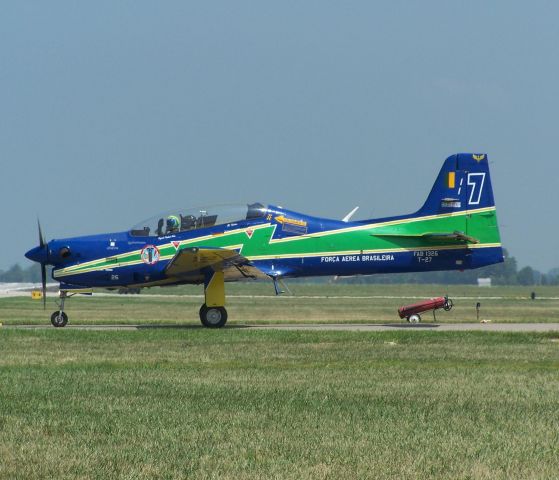 N1326 — - 1326 Coded 7 T-27 Tucano Brazilean AF seen at the Dayton Airshow in 2007, just prior to thier superb flying routine ...see the pilot waving at me !! ...Photo by Mike Day