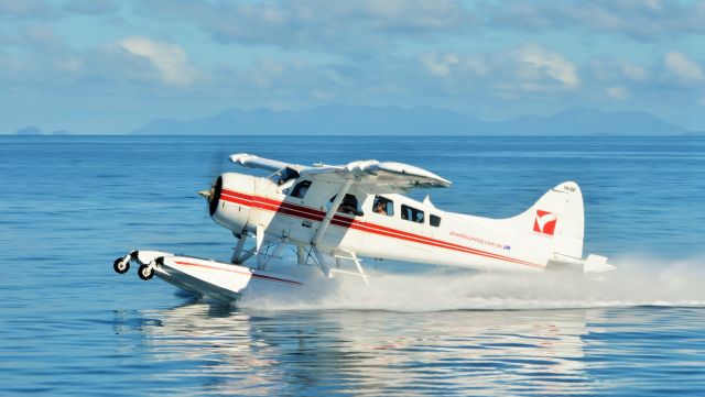 De Havilland Canada DHC-2 Mk1 Beaver (VH-AWI) - Little India taking off from Hayman Island, Qld.