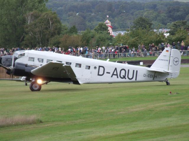 de Havilland Dash 8-400 (D-AQUI) - At Goodwood Revival, motor race meeting around the perimeter of Goodwood Aerodrome (ex_RAF Westhampnett), photo taken on 15 September 2013.br /Is this D-AQUI or D-CDIH - the latter shown in the smaller letters under the tail plane?