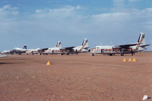 Fokker Maritime Enforcer (VH-FND) - BIRDSVILLE LINE UP35MM SLIDE CONVERSION USING A LIGHTBOX AND A NIKON L810 DIGITAL CAMERA IN THE MACRO MODE OF - FOKKER F-27-200S - BIRDSVILLE QLD. AUSTRALIA - YBDV 