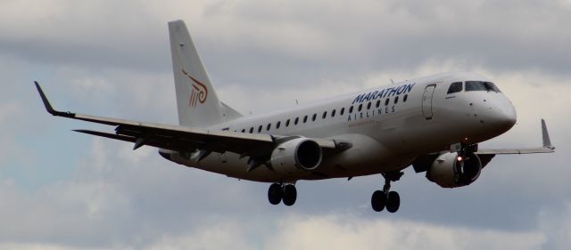 Embraer 175 (SX-ASK) - A Marathon Airlines E175 (operating for Flybe at the time) on final approach into LHR, landing on runway 27R.br /br /Location: Northern Perimiter Road, beside Runway 27R.br /Date: 26.08.22 (dd/mm/yy).
