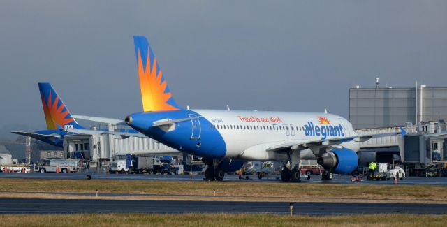 Airbus A320 (N222NV) - Waiting for it's flight to Orlando is this 2001 Allegiant Airbus 320-214 on New Years Day 2024.