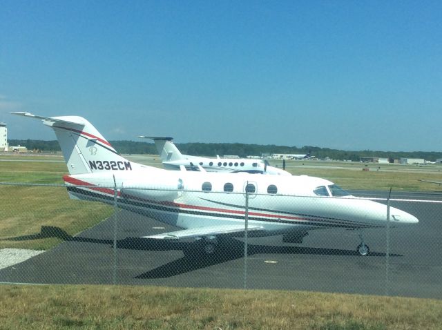 Beechcraft Premier 1 (N332CM) - Parked on apron at MAC Jets.