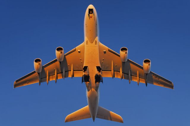 Airbus A380-800 (F-HPJC) - The intense glow of the setting sun paints an Air France operated Airbus A380-861 super jumbo golden, as it takes to the skies after departure from the Los Angeles International Airport, LAX, in Westchester, Los Angeles, California