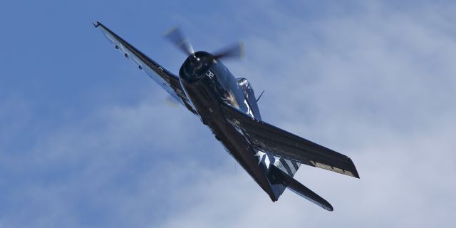 — — - FH&CAMs beautiful Grumman F6F-5 climbing out at Paine Field, Everett, Wa. 