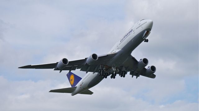 BOEING 747-8 (D-ABYP) - BOE35 climbs from Rwy 16R to begin its maiden flight on 5/16/14. (LN:1500 / cn 37840).