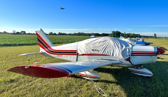 Piper Cherokee (N95044) - After a long flight from Texas, N95044 rests in her parking spot in the “South 40” at the EAA Airventure grounds at OSH.