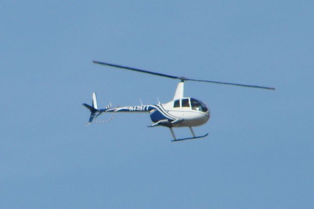 Robinson R-44 (N71977) - Robinson R-44 (N71977) departs Sarasota-Bradenton International Airport