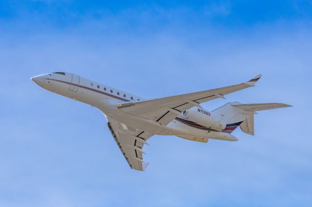 Bombardier Global 5000 (N113QS) - A NetJets Bombardier Global 5000 taking off from PHX on 2/13/23, the busiest day in PHX history, during the Super Bowl rush. Taken with a Canon R7 and Canon EF 100-400 II L lens.