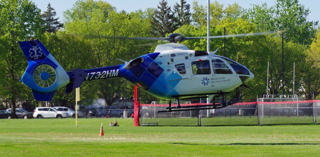 Eurocopter EC-635 (N732HM) - RAHWAY, NEW JERSEY, USA-MAY 09, 2022: A medical transportation helicopter is seen taking off from in front of the Rahway Middle School for a short flight from Robert Wood Johnson Hospital-Rahway, N.J. to Robert Wood Johnson Hospital-New Brunswick, N.J. When transporting to or from RWJ-Rahway, the helicopter will use the school's ball field as a landing zone because the hospital lacks a permanent fixed heli-pad. As such, it uses the nearest fixed heli-pad as its landing code, Merck and Company's 7NJ8, located about a mile away.