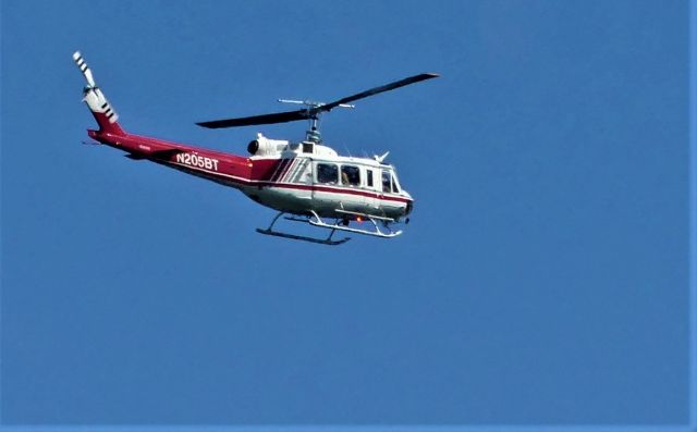 Bell UH-1V Iroquois (N205BT) - Taken from Jackson Peak Lookout on the Boise National Forest east of the town of Lowman, Idaho. Flying from South to North at about 8,000 feet.