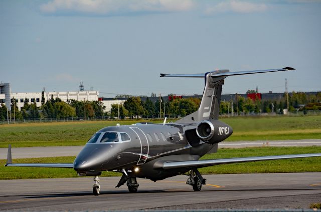 Embraer Phenom 300 (N911EJ) - Visiting CYHU on 09-09-2022