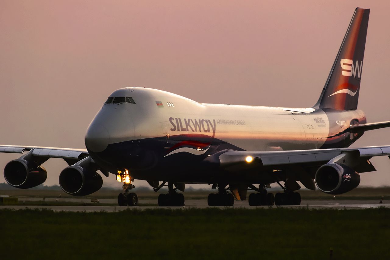 BOEING 747-8 (4KSW800) - In sunset.