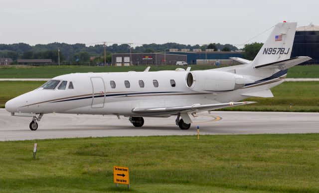 Cessna Citation Excel/XLS (N957BJ) - A Cessna 560XL pulls off the taxi way, towards the parking ramp at KVPZ.