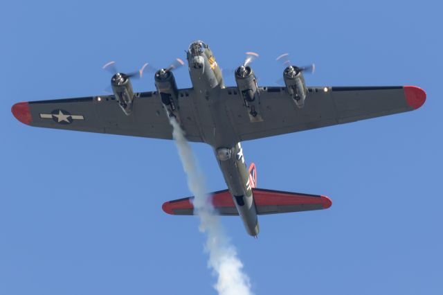 — — - B-17G of the Commemorative Air Force. Called the Texas Raiders , this aircraft was photographed in Houston as it was leaving the Houston Executive Airport after an airshow in April of 2019. It did a flyover after taking off and flying the pattern, turning on the smoke before flying home to Conroe, TX.