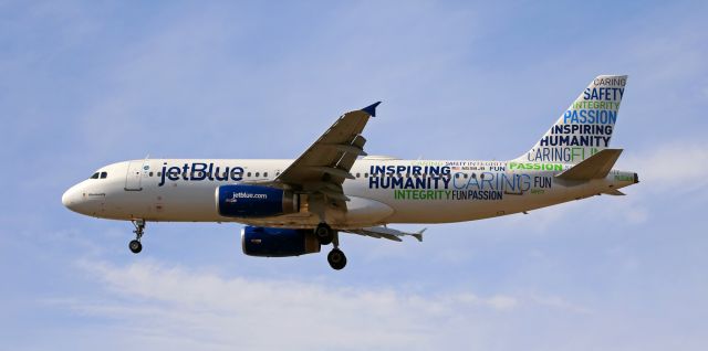 Airbus A320 (N598JB) - In this snap taken only 15 minutes after high noon, jetBlues "Bluemanity" (N598JB) is only a few seconds away from landing at Reno Tahoe International at the end of the daily flight from Long Beach.br /* I recommend clicking on FULL to view this photo at its original Q & C. *