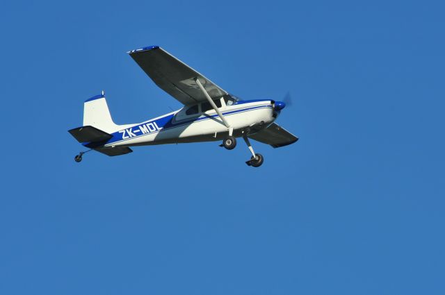 Cessna Skywagon 180 (ZK-MDL) - Here I was, standing on a dairy farm milking shed roof at Eyrewell Forest, near Christchurch International Airport and the small airstrip, Forest Field taking some photos for work. I heard an aero-engine, and naturally looked up! - There, coming at me at some speed was this beaut old Cessna 180, scooting across the farm paddocks at quite a low height. As to be expected, the camera was positioned very quickly to capture this lovely airplane against a gorgeous winter blue sky day.