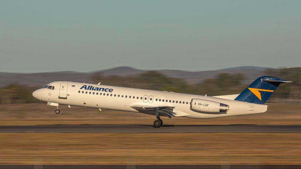 Fokker 100 (VH-UQF) - Take off from YBRK.  Photographed from the viewing area at Freight.